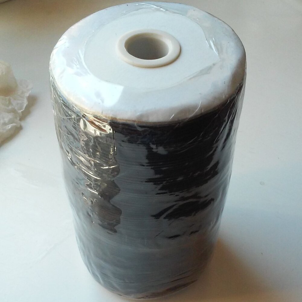 Unopened Roll Of Black Elastic EC--R030-10mm-02--ROLL Is 5 1/2" Tall 3 1/4" Wide